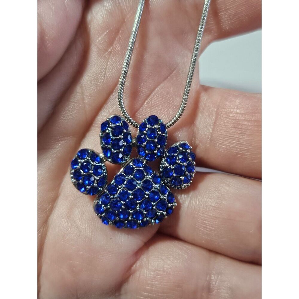 Silver tone blue rhinestone paw print pendant necklace 17-19"